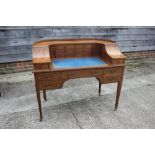 A Carlton House mahogany desk decorated satinwood banding, top inset blue leather, 48" wide