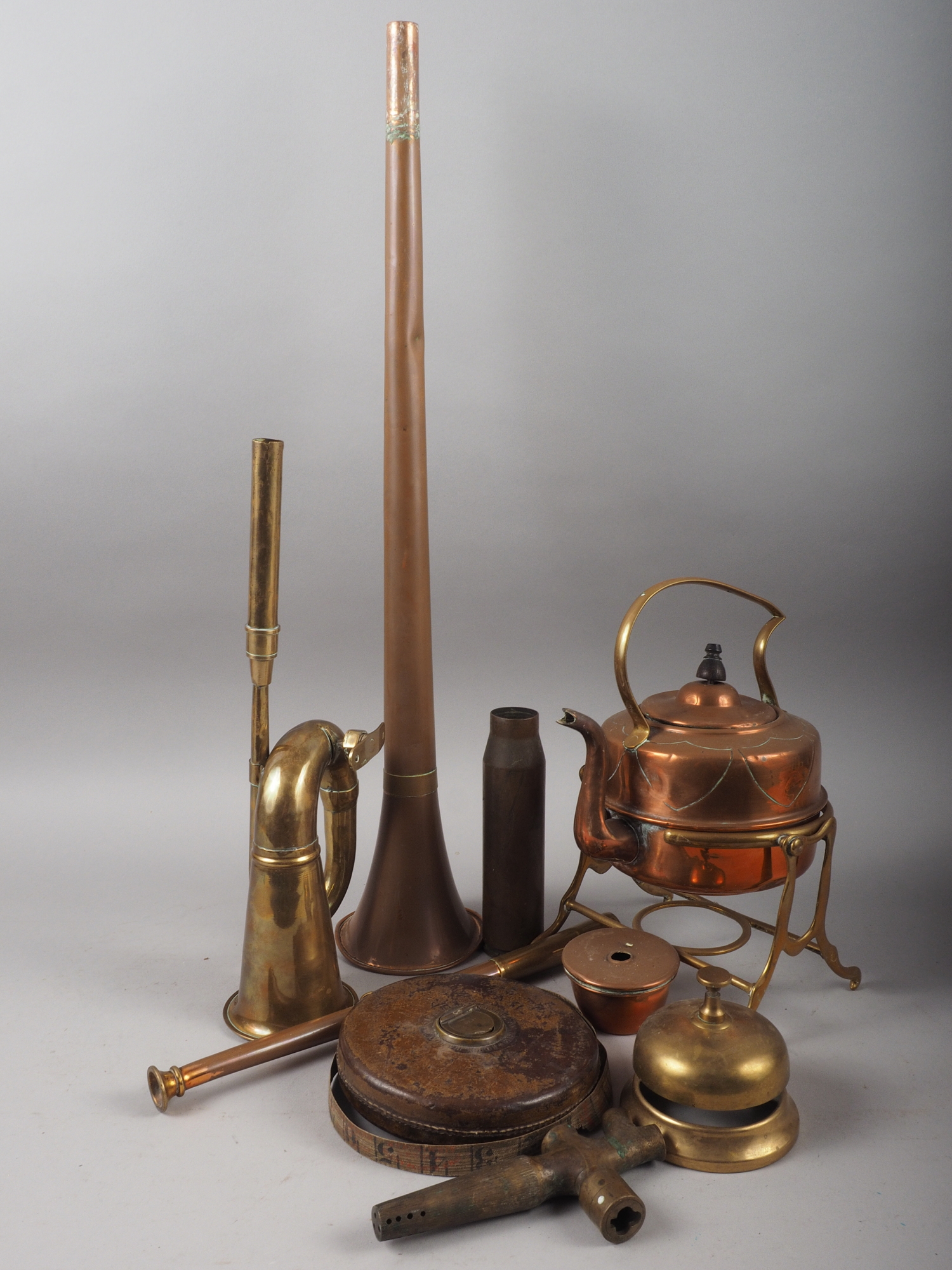 A copper kettle, on stand, a posting horn, 33 3/4" long, a beer tap and other items