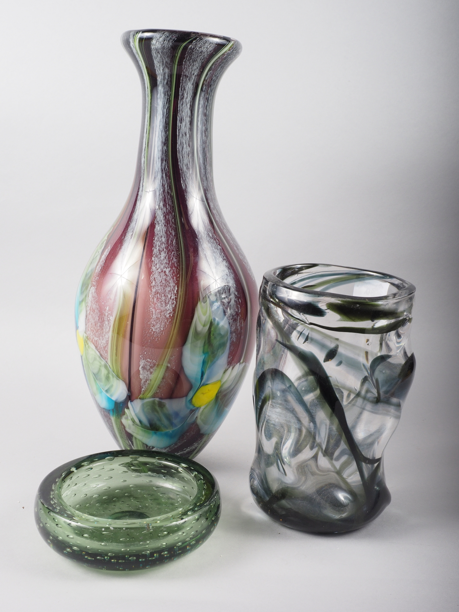 A Whitefriars black streaky design vase, a green controlled bubble design ashtray and a modern