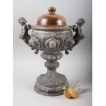 A 19th century spelter relief decorated two-handle trophy with huali hardwood cover, 15" high