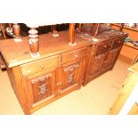 A pair of dark oak chests, fitted two short drawers over cupboards with linen fold doors, 36" wide