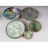An assortment of studio pottery dishes, a Winstanley seated cat ornament, etc