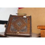 A carved oak coal scuttle, an oak circular tray top book table, on cabriole claw and ball