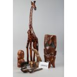 A quantity of treen, including a carved hardwood giraffe, 31 1/2" high, a model elephant, a pair