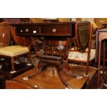 A mahogany sofa table with tooled lined top and leaves, on 'U' shaped support and splay feet, 35"