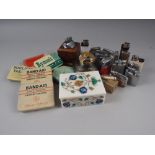 A collection of vintage cigarette lighters, an inlaid marble cigarette box and a small collection of