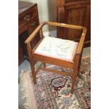 An Edwardian mahogany and line inlaid box seat piano stool, on square taper supports