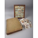 A postcard album containing 19th century and later postcards, loose cigarette cards, and twenty-