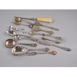 Three silver spoons, a pair of white metal sugar tongs, 3oz troy approx, and a small selection of