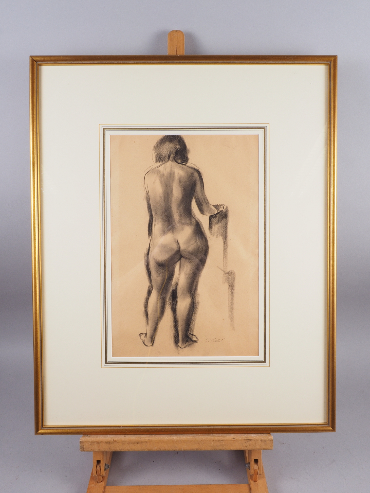 Charles McCall: a charcoal study of a standing nude, 14 1/2" x 9 3/4", in gilt strip frame