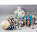 A Chinese porcelain figure of Hotei and other porcelain figures