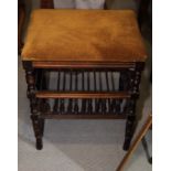 An early 20th century rectangular stained wooden piano stool with seat upholstered in a gold fabric