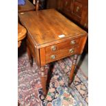 A 19th century mahogany drop leaf work table, fitted two drawers with ring handles, on slender