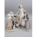 Three Lladro figures comprising a 1920s woman, 13 1/2" high, three singing children and a mother