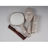 A four-piece Mappin & Webb silver backed dressing table set