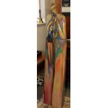A South African painted pottery and wood tourist sculpture, 59" high