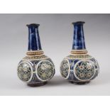 A pair of Royal Doulton blue and green glazed bottle vases, 9" high, and a pair of Doulton