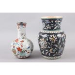 An early 19th century polychrome enamel baluster vase, decorated flowers and precious objects with