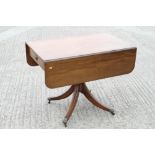 A mid 19th century mahogany Pembroke table, fitted one drawer, on central column and quadruple splay