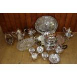 A silver plated tea set, plated trays, a bottle holder, assorted plate