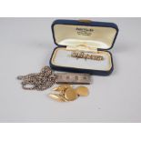 A 9ct gold tie pin, 4.2g, a pair of 18ct gold cufflinks, 6.6g (damages) and a silver ingot pendant
