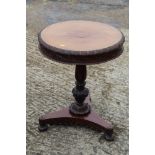 A William IV carved mahogany drum top occasional table, on acanthus scroll column, triform base
