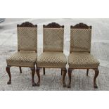 Three German carved walnut high back standard dining chairs with padded seats and backs, on cabriole