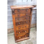 A 19th century 'Wellington' walnut chest of seven drawers with knob handles, on block base, 22"