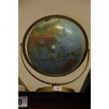 A terrestrial globe, on stand