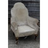 A hump back armchair, upholstered in a cream brocade, on cabriole supports