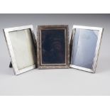 Three silver photo frames, 6" x 5", various