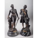 A pair of anodised brass figures of Wellington and Nelson, on turned hardstone bases, both 17" high