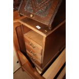 A pair of walnut bedside cabinets, fitted recess over three drawers, on bracket supports, 12" wide x