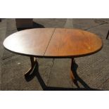 A G-Plan teak oval dining table, 64" wide