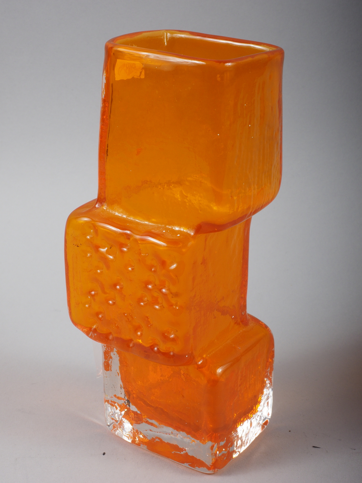 A Whitefriars orange coloured "Drunken Bricklayer" vase, 8 1/2" high