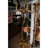 A carved and painted wood blackamoor five-light candelabra, on plinth base, 69" high to light fit