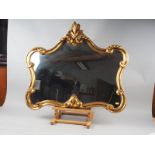 A gilt framed wall mirror with shaped scrolled frame, plate 19" x 29"