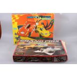 A boxed Scalextric Grand Prix set and a Scalextric Micro Mania Thunder Bugs set