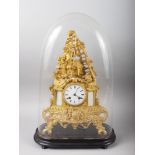 A late 19th century French mantel clock in ormolu case with 18th century figure surmount, white