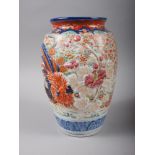 An Imari ovoid vase with sides moulded cockerel, 9" high