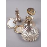 A silver capstan inkwell, a silver pepperette, a silver powder compact, a silver shell butter dish