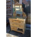 A late 19th century waxed pine dressing chest, fitted swing frame mirror over two long drawers,