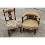 A late 19th century walnut and inlaid tub chair, on turned and castored supports, and a late