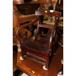 A child's 19th century mahogany scroll arm bar back chair