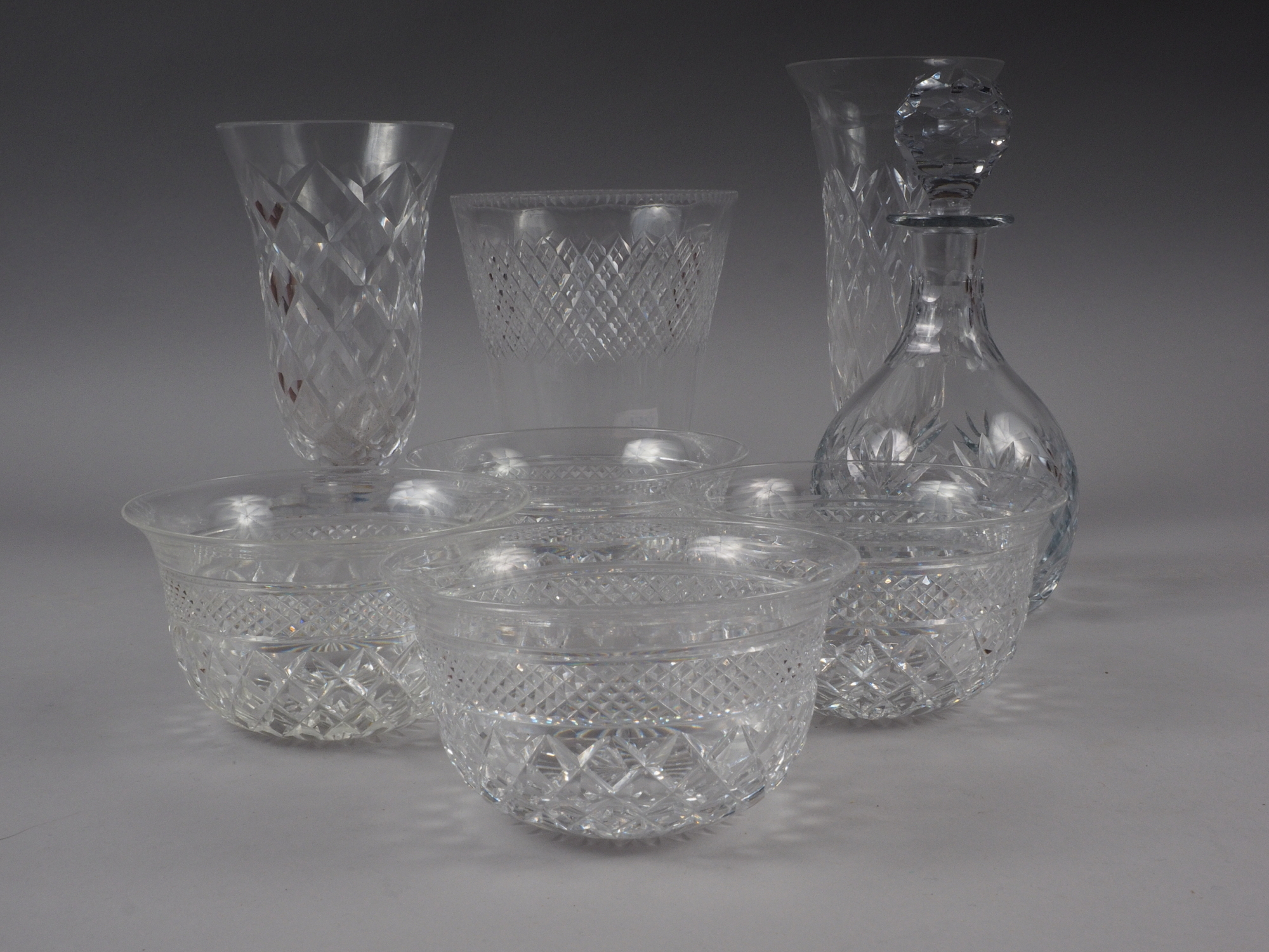A selection of cut crystal drinking glasses by Stewart and others