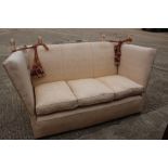 A Knole settee with loose seat and back cushions, upholstered in a geometric fabric, 70" wide