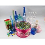 A Mdina pink glass scent bottle and stopper, a number of coloured glass bottles, ten Babycham coups,
