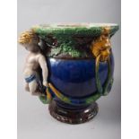 A 19th century majolica two-handle vase with putto and swags, 10" high