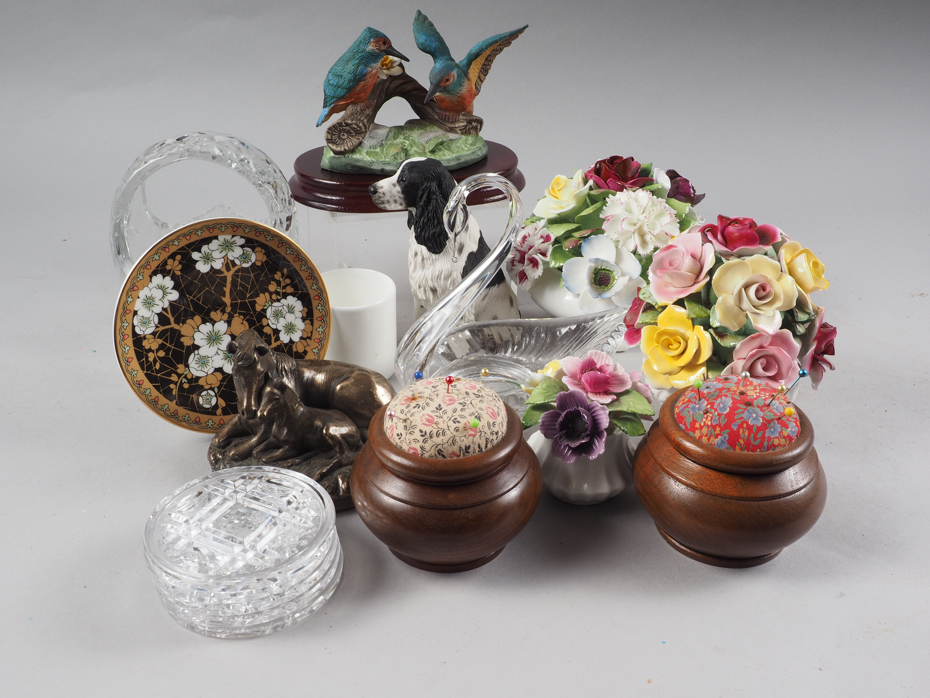 A Royal Doulton ceramic floral display, two other floral displays, two pin cushions, a glass