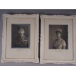 A pair of signed portrait photographs of King George V and Queen Mary, dated 1919, in white ornate